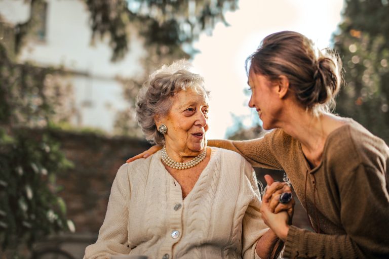 JB At-Home Care caregiver assisting an elderly client at home